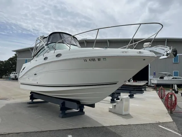 Slide: The Image of 2005 Sea Ray 270 Amberjack boat on stands in a marina. - 23