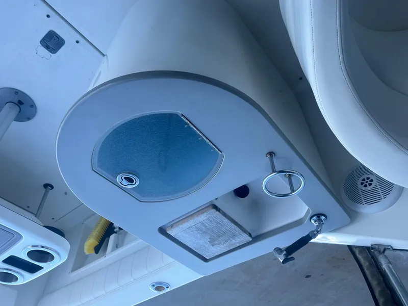 Slide: The Image of 2005 Sea Ray 270 Amberjack boat interior console with storage compartment. - 29