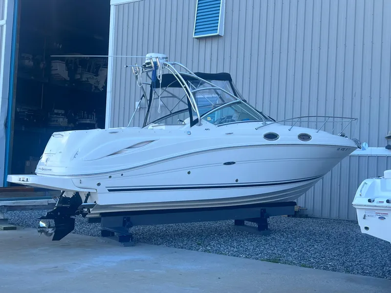 Slide: The Image of 2005 Sea Ray 270 Amberjack boat on a trailer outside a storage facility. - 3