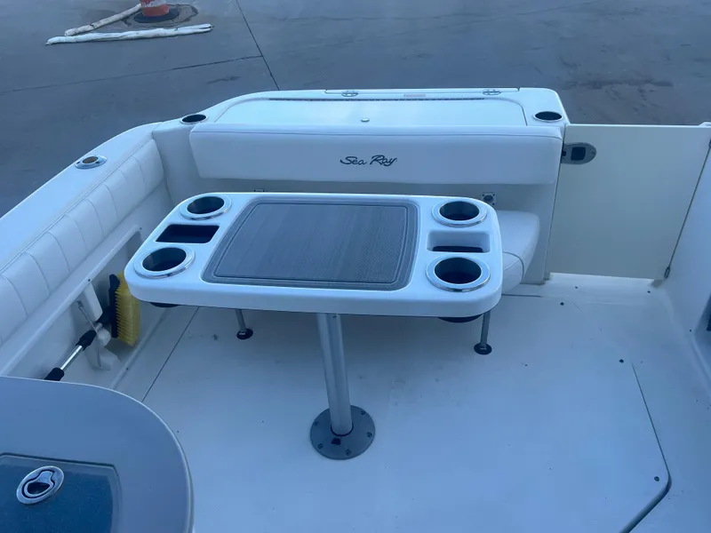 Slide: The Image of 2005 Sea Ray 270 Amberjack boat interior with seating and table. - 30