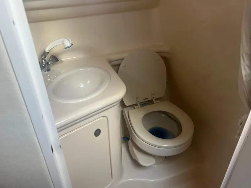 Slide: The Image of 2005 Sea Ray 270 Amberjack boat bathroom with sink and toilet. - 34