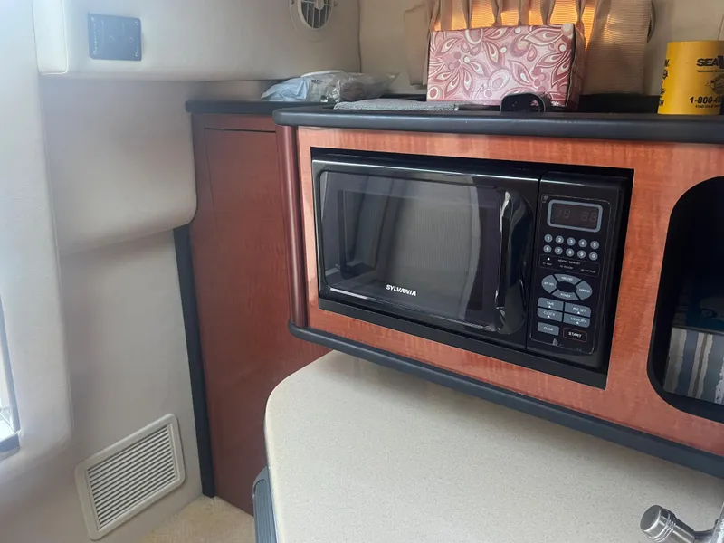 Slide: The Image of Microwave in the galley of a 2005 Sea Ray 270 Amberjack boat. - 35