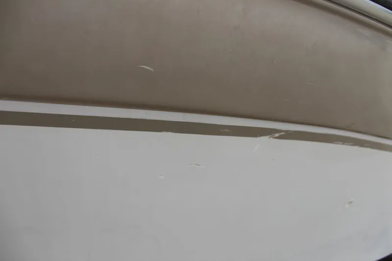Slide: The Image of Close-up of 2005 Four Winns HORIZON 200 boat hull with visible scratches. - 15