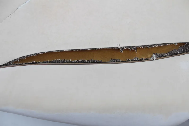 Slide: The Image of Torn upholstery on 2005 Four Winns HORIZON 200 boat seat. - 18
