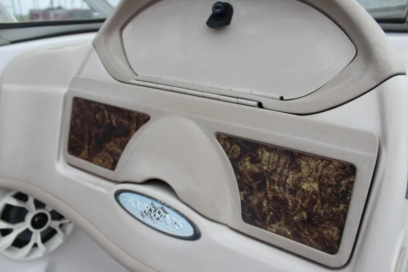 Slide: The Image of 2005 Four Winns HORIZON 200 dashboard with wood accents and speaker detail. - 31