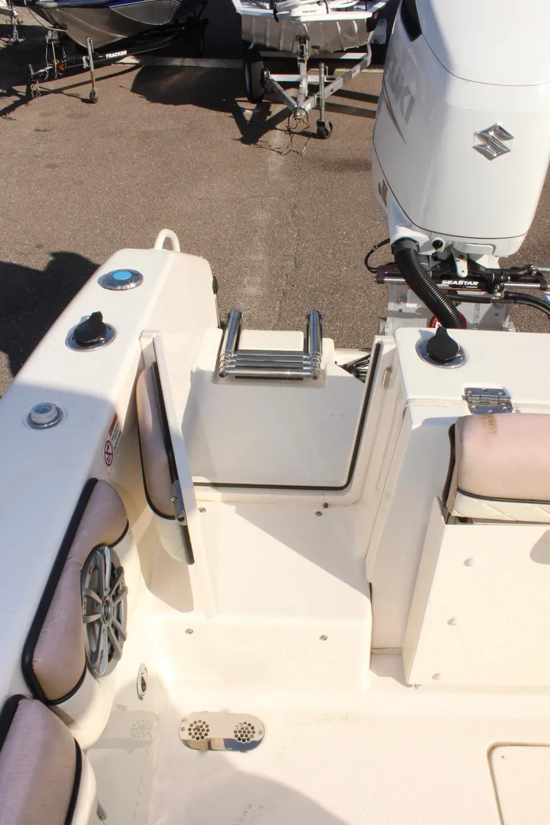 Slide: The Image of 2023 Sea Chaser 27 HFC boat interior with Suzuki outboard motor. - 10