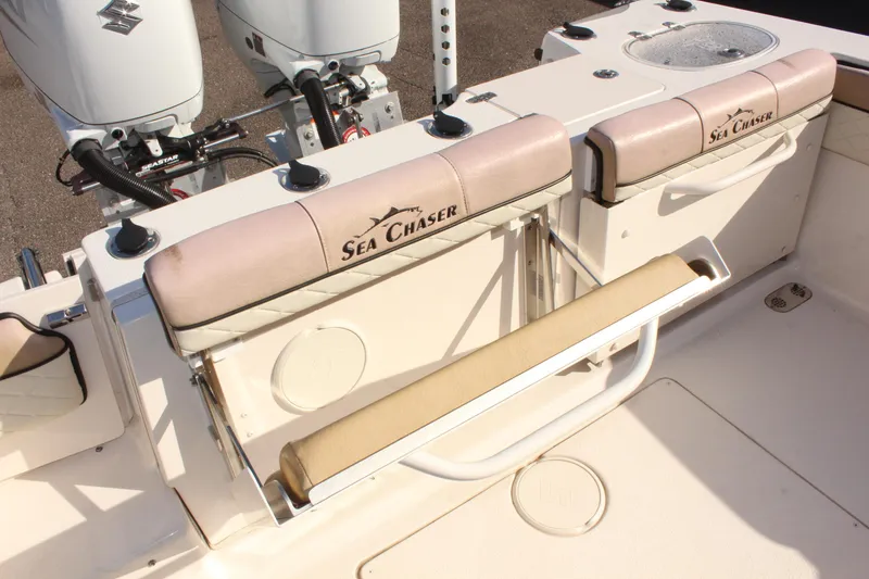 Slide: The Image of 2023 Sea Chaser 27 HFC boat seating and dual outboard motors. - 13