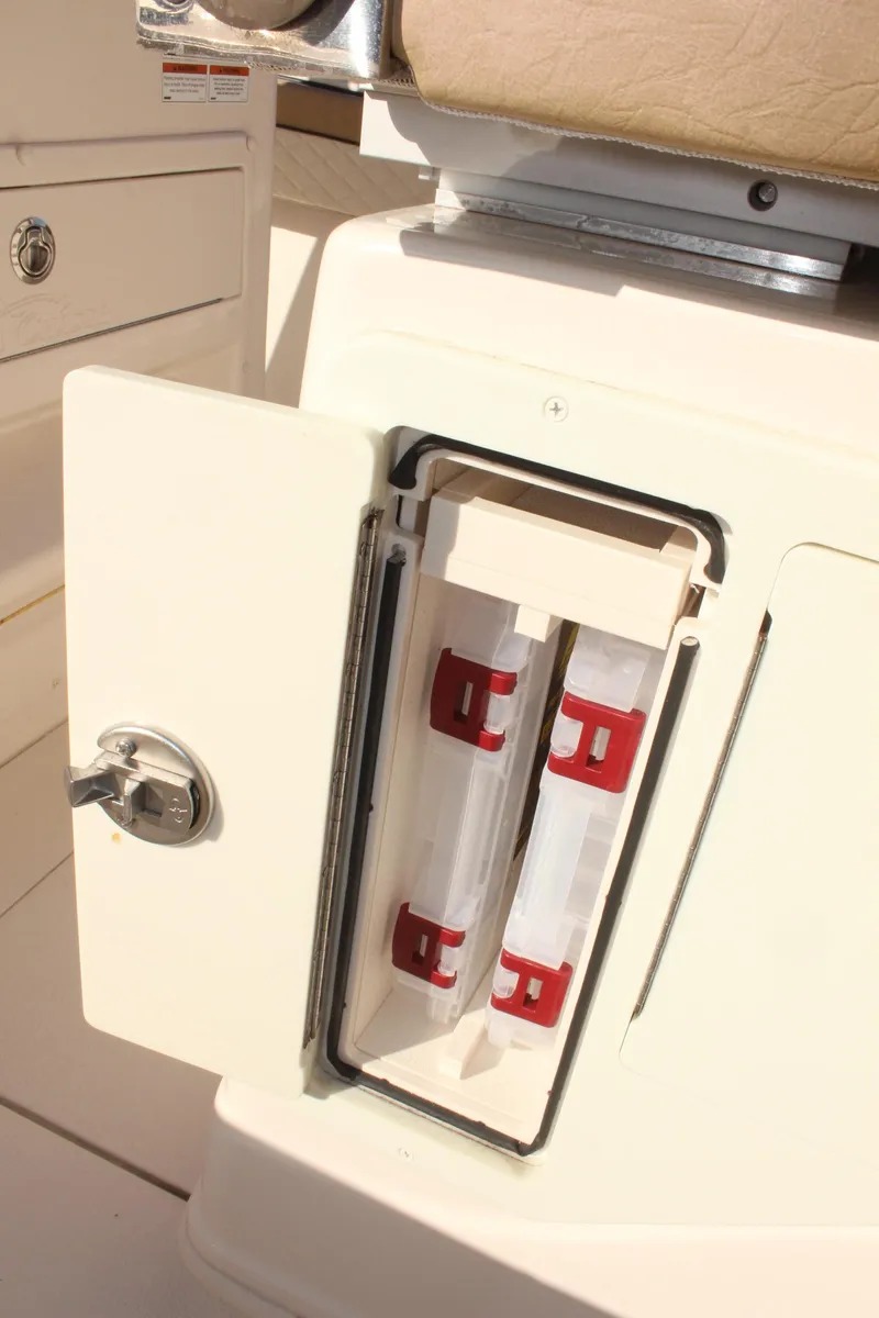 Slide: The Image of 2023 Sea Chaser 27 HFC boat storage compartment with secure latch. - 19