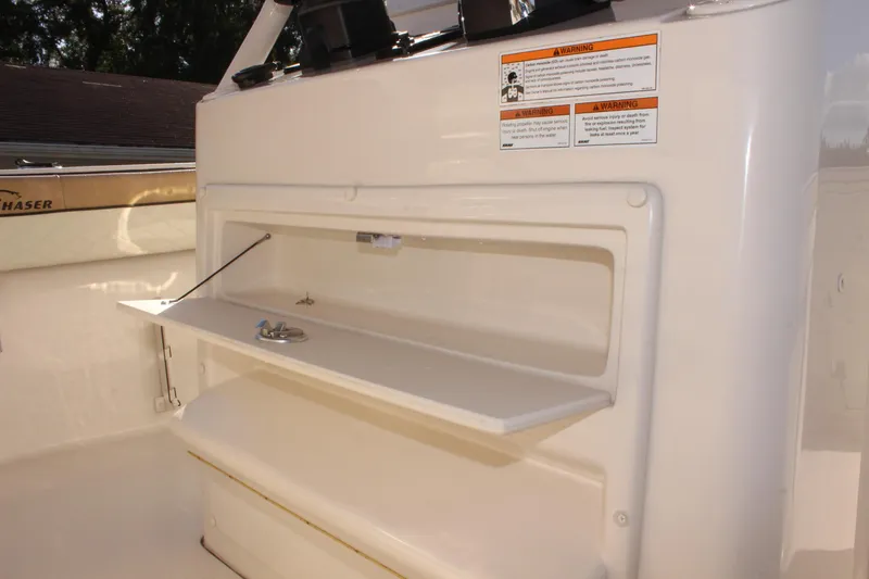 Slide: The Image of 2023 Sea Chaser 27 HFC boat storage compartment with open hatch. - 26