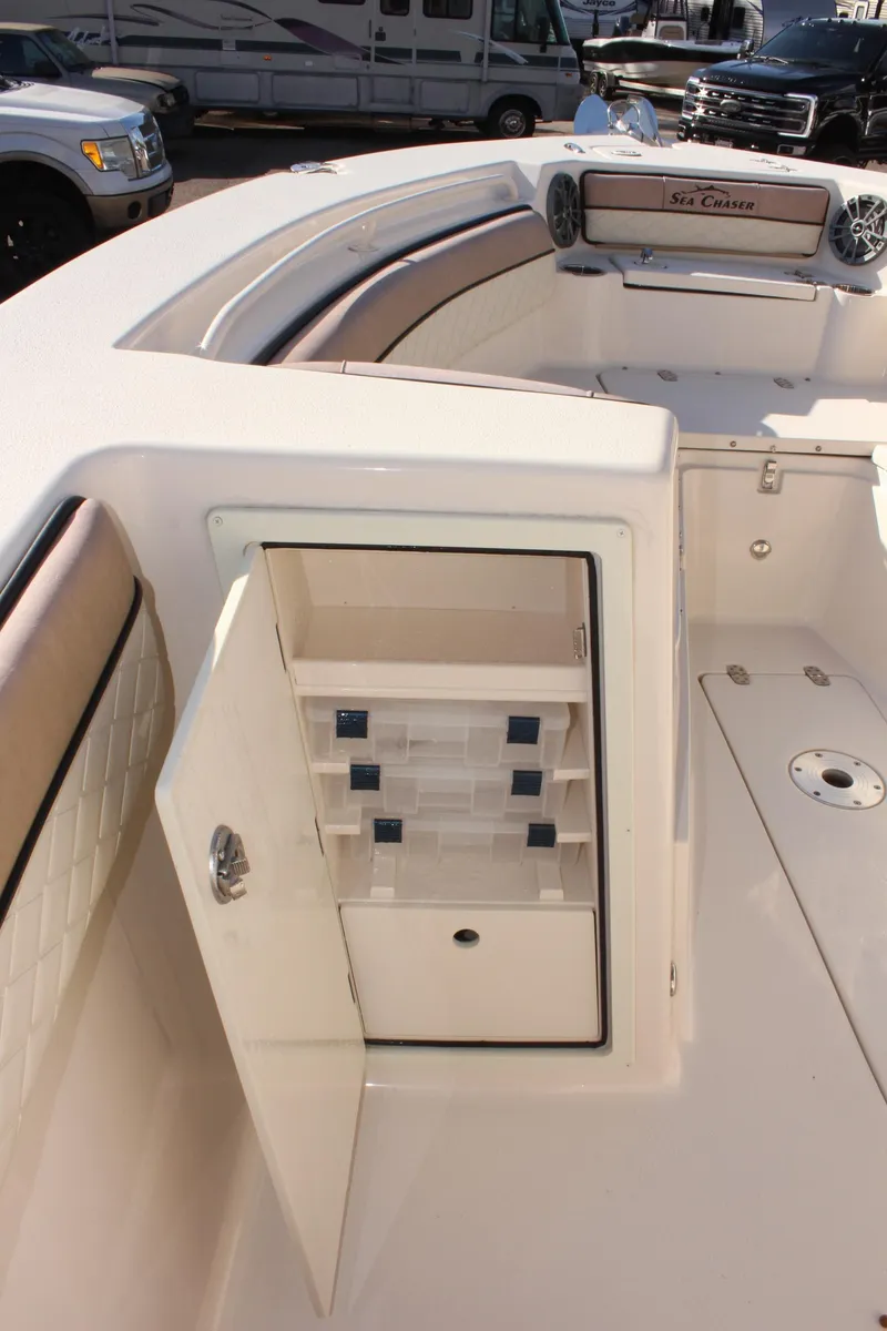 Slide: The Image of 2023 Sea Chaser 27 HFC boat interior with open storage compartment. - 33