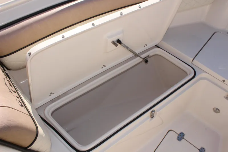 Slide: The Image of 2023 Sea Chaser 27 HFC boat storage compartment open, showcasing spacious interior. - 34