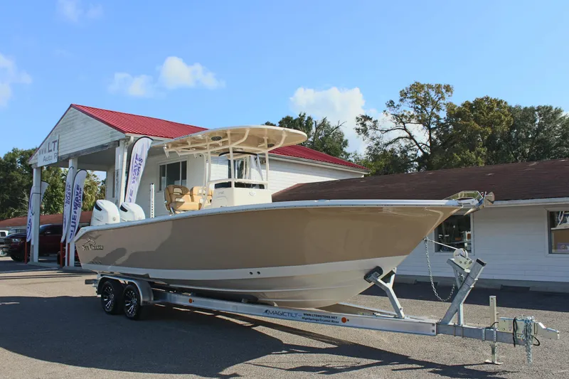 Slide: The Image of 2023 Sea Chaser 27 HFC boat on trailer outside dealership. - 4