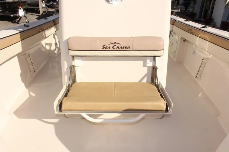 Slide: The Image of 2023 Sea Chaser 27 HFC boat seat with logo, beige upholstery. - 42