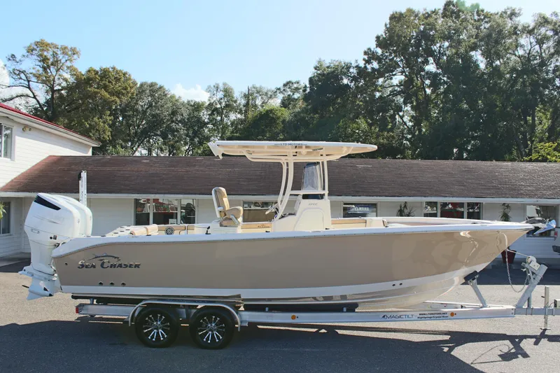 Slide: The Image of 2023 Sea Chaser 27 HFC boat on trailer, parked outdoors. - 5