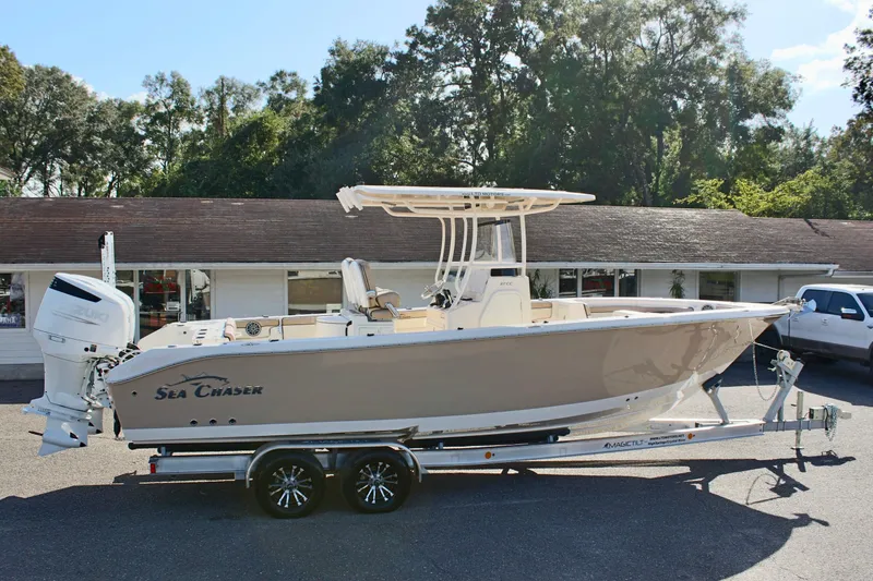 Slide: The Image of 2023 Sea Chaser 27 HFC boat on trailer, parked outdoors. - 6
