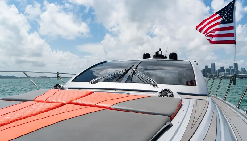 Slide: The Image of 2013 Azimut Atlantis 58 yacht with American flag, cruising on a sunny day. - 14