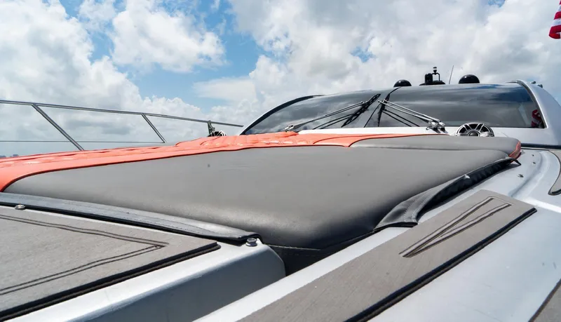 Slide: The Image of 2013 Azimut Atlantis 58 yacht deck with sleek design under a cloudy sky. - 15