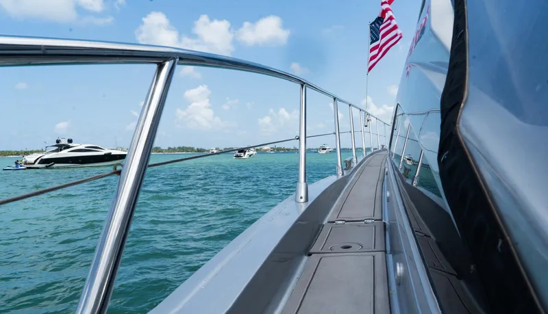 Slide: The Image of 2013 Azimut Atlantis 58 yacht deck with ocean view and American flag. - 19