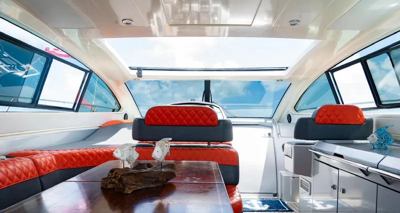 Slide: The Image of Luxurious interior of 2013 Azimut Atlantis 58 yacht with red seating and panoramic windows. - 24