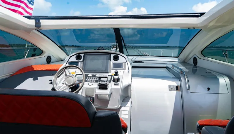 Slide: The Image of Cockpit view of 2013 Azimut Atlantis 58 yacht with modern controls and ocean backdrop. - 29