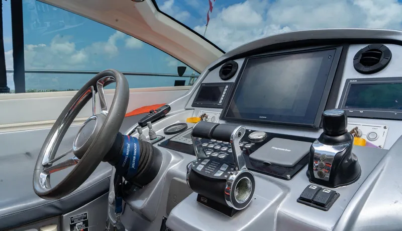 Slide: The Image of Cockpit of 2013 Azimut Atlantis 58 yacht with modern navigation controls and steering wheel. - 30