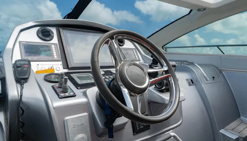 Slide: The Image of Cockpit of 2013 Azimut Atlantis 58 yacht with steering wheel and navigation controls. - 31