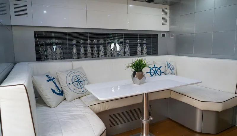 Slide: The Image of Luxurious interior of 2013 Azimut Atlantis 58 yacht with white seating and nautical decor. - 42