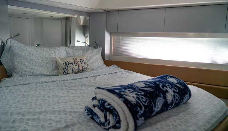 Slide: The Image of Luxurious bedroom interior of 2013 Azimut Atlantis 58 yacht with cozy bedding. - 43