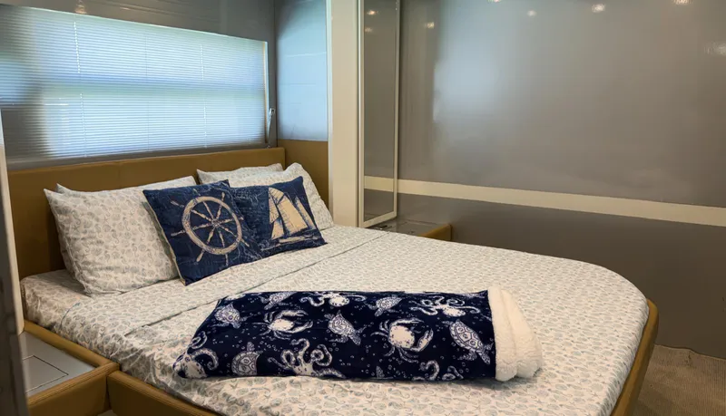 Slide: The Image of Luxurious bedroom interior of 2013 Azimut Atlantis 58 yacht with nautical-themed decor. - 44