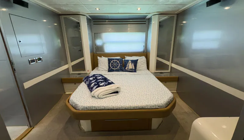 Slide: The Image of Luxurious bedroom interior of 2013 Azimut Atlantis 58 yacht with nautical-themed decor. - 45