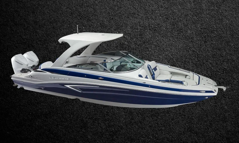 Slide: The Image of 2023 Crownline E305XS boat with sleek design and blue accents. - 7
