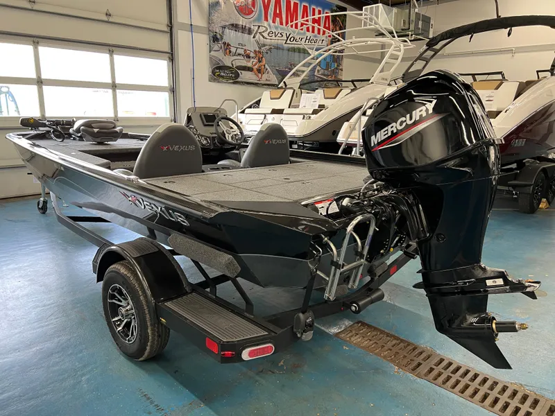Slide: The Image of 2023 Vexus AVX181 boat with Mercury outboard motor in showroom. - 3