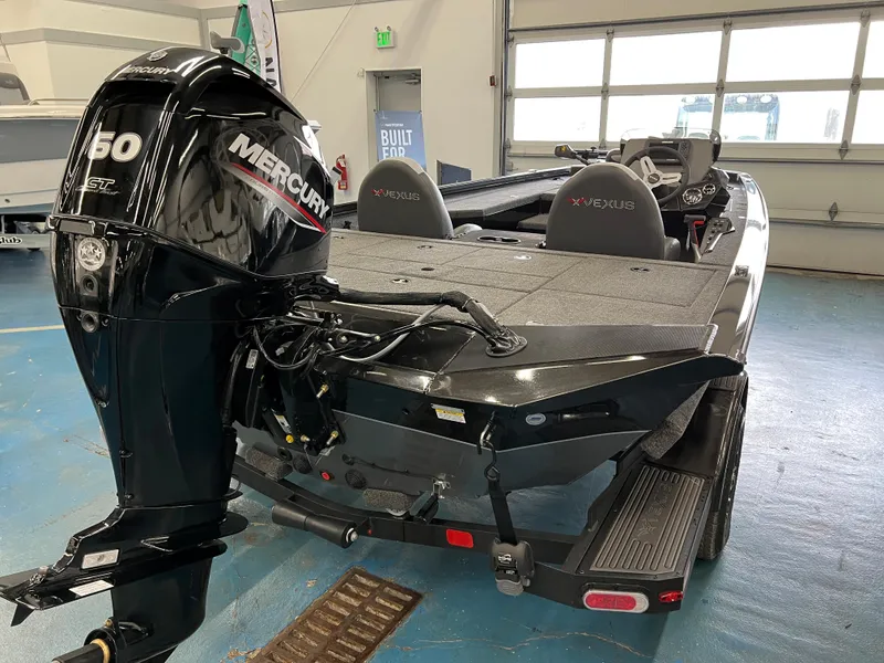 Slide: The Image of 2023 Vexus AVX181 boat with Mercury 60 HP engine in showroom. - 4