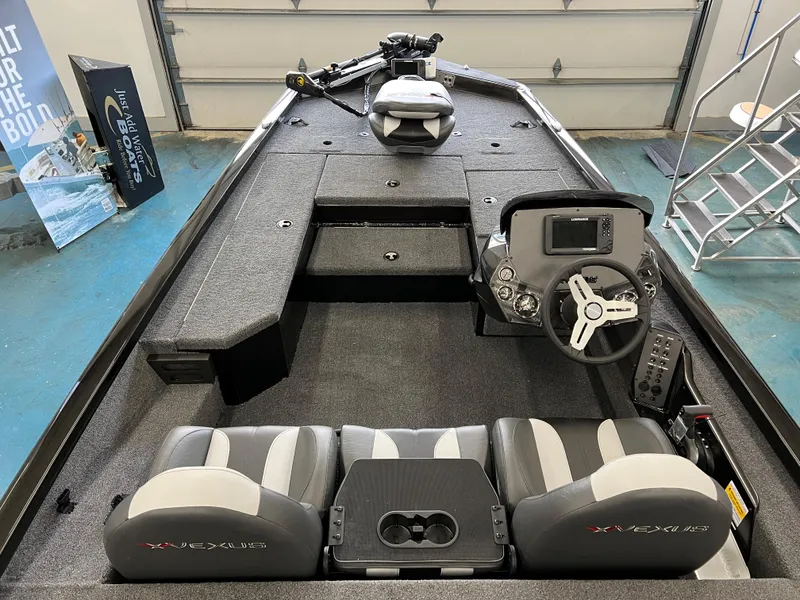 Slide: The Image of 2023 Vexus AVX181 fishing boat interior with steering console and seating. - 6