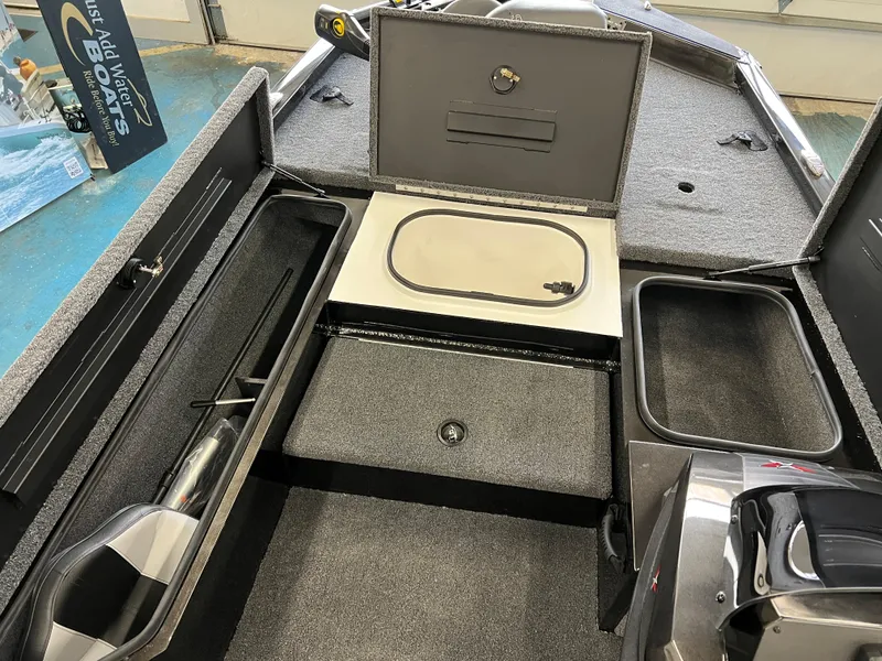 Slide: The Image of 2023 Vexus AVX181 boat interior with storage compartments and livewell. - 8