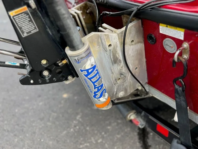 Slide: The Image of Close-up of 2016 Triton 21 TrX boat's Atlas hydraulic jack plate. - 5