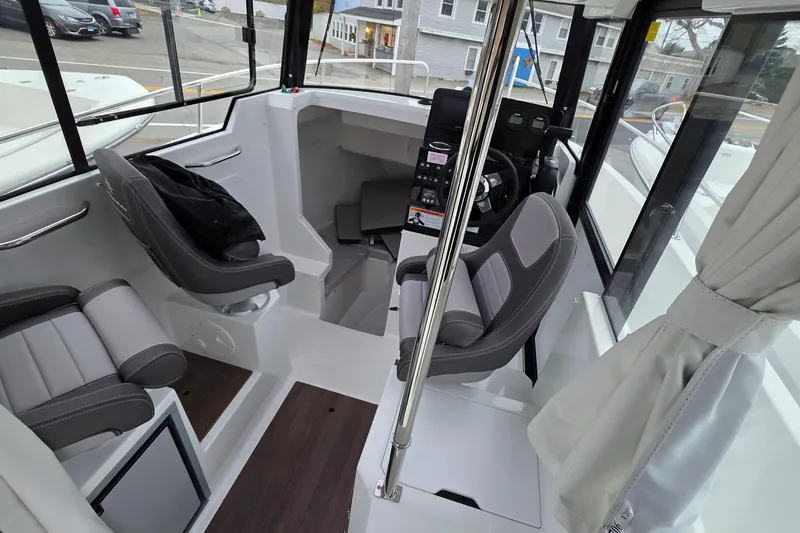 Slide: The Image of Interior of 2023 Jeanneau NC 695 Sport Serie 2 boat with modern seating and controls. - 15