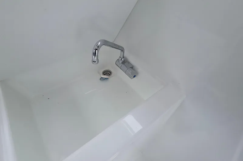 Slide: The Image of 2023 Jeanneau NC 695 Sport Serie 2 sink with chrome faucet. - 16