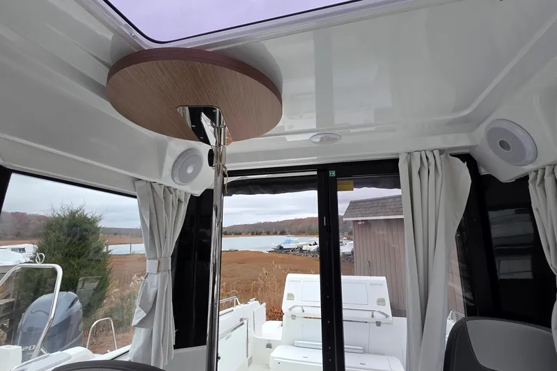 Slide: The Image of Interior view of 2023 Jeanneau NC 695 Sport Serie 2 boat with modern design features. - 18