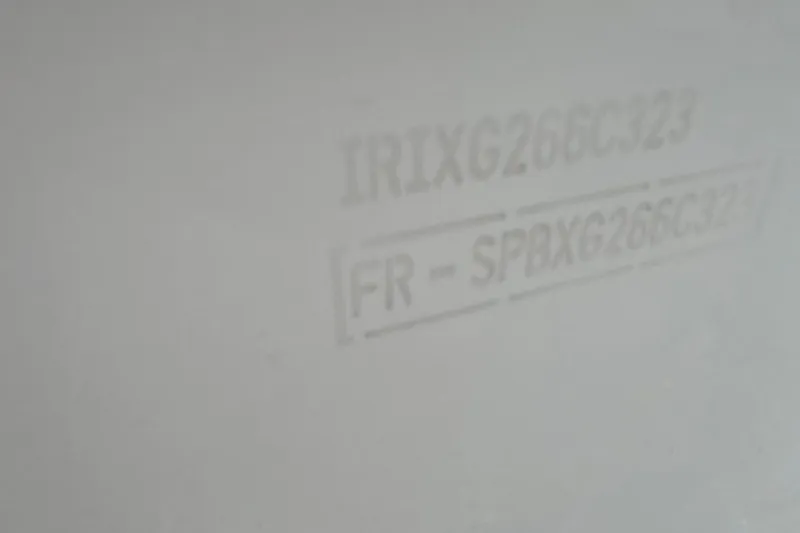 Slide: The Image of 2023 Jeanneau NC 695 Sport Serie 2 hull identification number on white surface. - 26