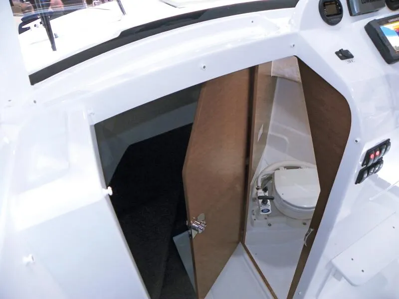 Slide: The Image of Couple enjoying a day on a 2023 Jeanneau NC 695 Sport S2 boat. - 8