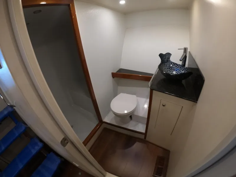 Slide: The Image of Luxurious bathroom in 2005 Custom Carolina C 30 CAT yacht with modern fixtures. - 10