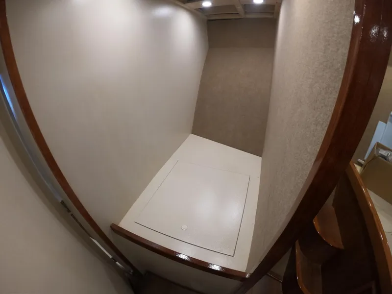 Slide: The Image of Interior of 2005 Custom Carolina C 30 CAT boat with storage compartment. - 11