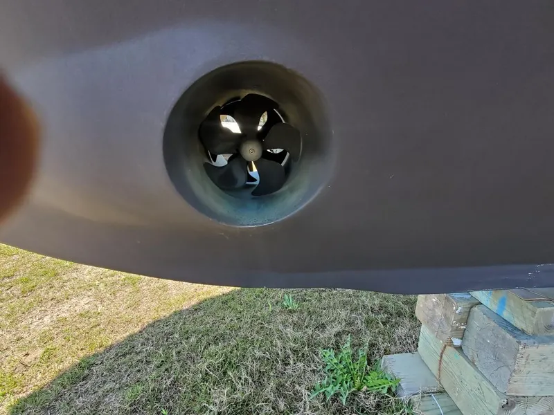 Slide: The Image of Bow thruster of 2005 Custom Carolina C 30 CAT boat on dry land. - 12