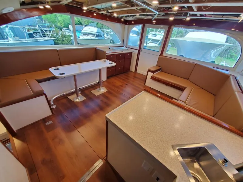 Slide: The Image of Luxurious interior of 2005 Custom Carolina C 30 CAT yacht with seating and dining area. - 20