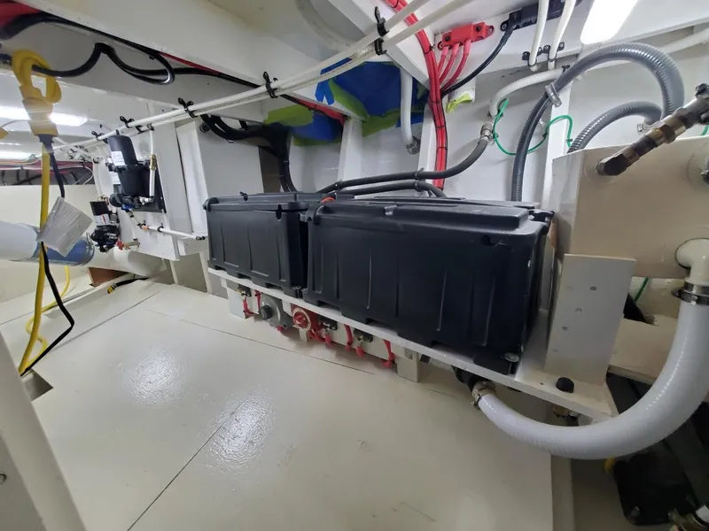 Slide: The Image of Engine room of 2005 Custom Carolina C 30 CAT with visible wiring and components. - 27