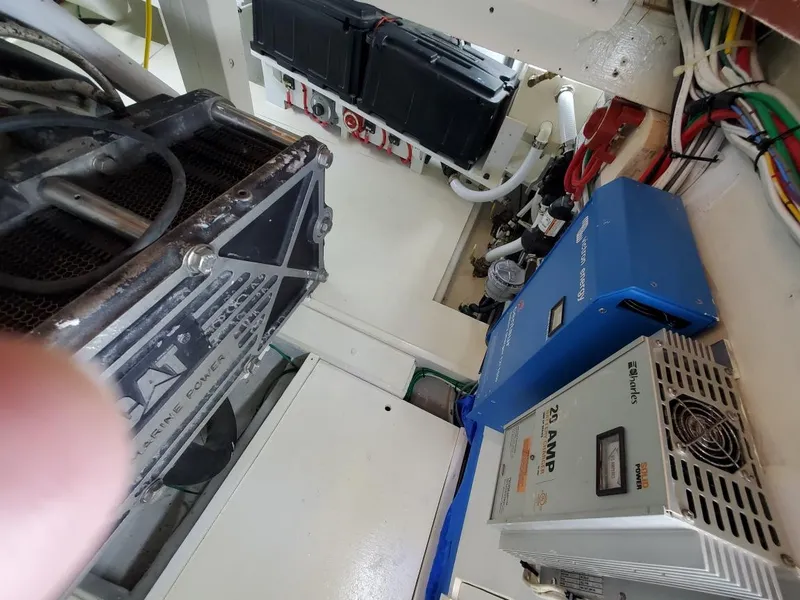 Slide: The Image of Engine room of 2005 Custom Carolina C 30 CAT with electrical components and wiring. - 28