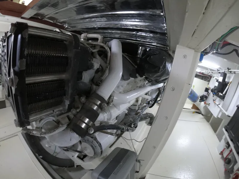 Slide: The Image of Engine room of 2005 Custom Carolina C 30 CAT boat, showcasing mechanical components. - 4