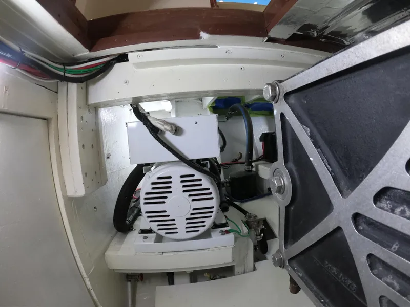 Slide: The Image of Engine room of 2005 Custom Carolina C 30 CAT boat, showcasing mechanical components. - 6