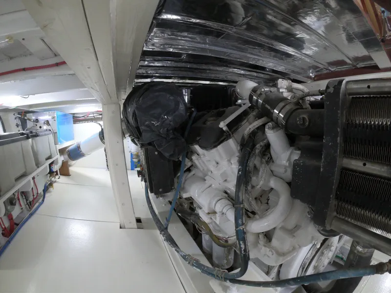 Slide: The Image of Engine room of 2005 Custom Carolina C 30 CAT boat, showcasing mechanical components. - 8